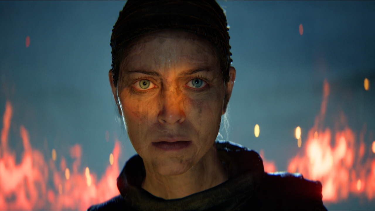 Senua surrounded by fire.